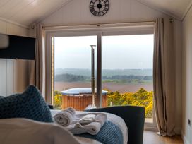 A bedroom with a hot tub view at The Grays in North Berwick