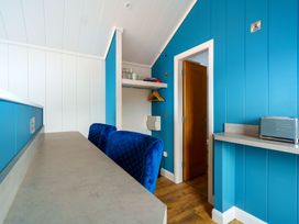 A kitchen with blue walls and counters at The Grays in North Berwick