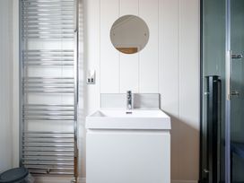 A bathroom with a sink and towel radiator at The Grays in North Berwick