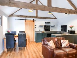 A kitchen with a dining area and a sofa at The Homestead in Moorsholm