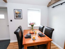 A dining room with a table set for breakfast at The Homestead in Moorsholm