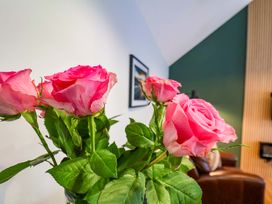 A bouquet of roses in a living room at The Homestead in Moorsholm