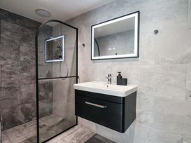 A bathroom with a shower and sink at The Homestead Moorsholm