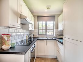 A kitchen with cabinets and a sink at Bargany (Pet) Dailly