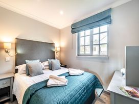 A bedroom with a bed and window at Bargany (Pet) in Dailly