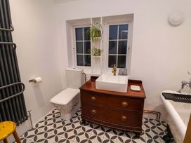 A bathroom featuring a sink and toilet at The White House in Norwich