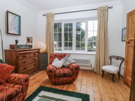 A living room with a sofa and a window at The White House in Bracondale