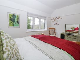 A bedroom with a bed and a window at The White House in Bracondale