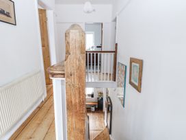 A staircase and hallway features at The White House in Bracondale