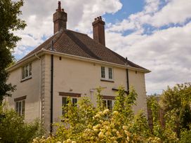 A house with windows and a garden at The White House, Riverside Retreat in Bracondale