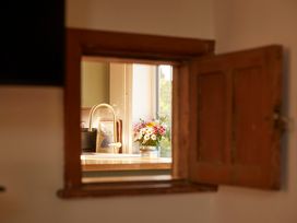 A kitchen view through a window at The White House, Riverside Retreat, Bracondale