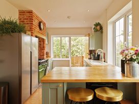 A kitchen with a refrigerator and stove at The White House, Riverside Retreat in Bracondale