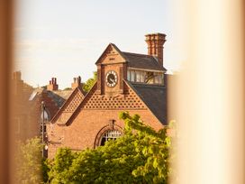 A building with a clock and windows at The White House, Riverside Retreat Bracondale