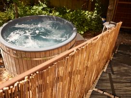 A hot tub in an outdoor area at The White House, Riverside Retreat