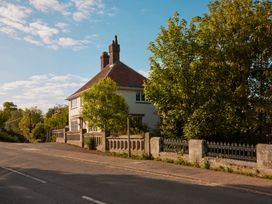 A house with trees and a road at The White House, Riverside Retreat in Bracondale