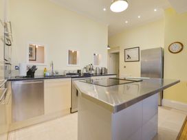 A kitchen with stainless steel appliances and a counter at The Old Signal House in Torpoint