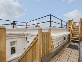 An outdoor space with a staircase leading to the roof at The Old Signal House in Torpoint