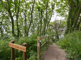 A pathway leading down with stairs and a sign at The Old Signal House in Torpoint