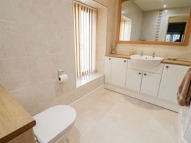 A bathroom with a sink and toilet at Grange Cottage in Crediton