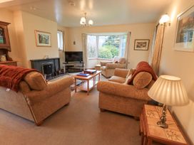 A living room with sofas and a television at Thrang View in Chapel Stile