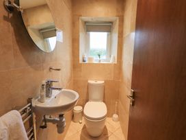 A bathroom with a sink and toilet at Thrang View in Chapel Stile