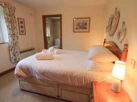 A bedroom with a bed and ensuite bathroom at Thrang View in Chapel Stile