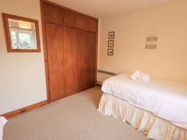 A bedroom with a bed and wardrobe at Thrang View in Chapel Stile