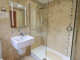 A bathroom with a shower and sink at Thrang View in Chapel Stile