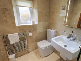 A bathroom with a toilet and sink at Thrang View in Chapel Stile