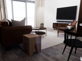 A living room with a sofa and coffee table at Arvo Suite 1.0 in Marhamchurch