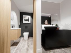 A bathroom with a sink and toilet at Arvo Suite 1.0 Marhamchurch