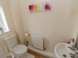 A bathroom with a toilet and sink at Ramblers Cottage in Alnwick