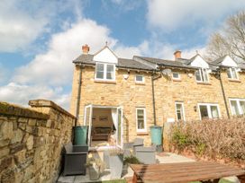 An outdoor area with patio furniture at Ramblers Cottage in Alnwick