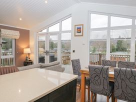 A dining room with tables and chairs at High Lake View Lodge White Cross Bay near Troutbeck Bridge