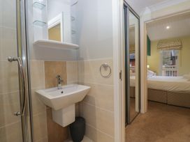 A bathroom with a sink and shower at High Lake View Lodge near White Cross Bay