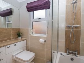 A bathroom with a sink, toilet, and bathtub at High Lake View Lodge near White Cross Bay