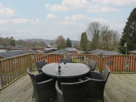 An outdoor area with a circular table and chairs at High Lake View Lodge near White Cross Bay