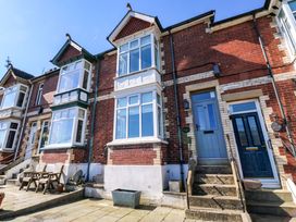 An external view of a house with windows and door at 43 Sandquay Road Dartmouth
