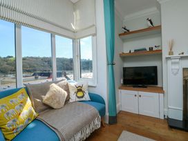 A living room with a sofa and television at 43 Sandquay Road Dartmouth