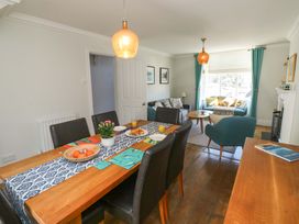 A dining room with a table and chairs at 43 Sandquay Road Dartmouth
