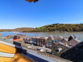 A view of rooftops and a river with boats at 43 Sandquay Road, Dartmouth