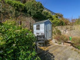 A garden with a shed and seating area at 43 Sandquay Road in Dartmouth