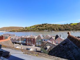 A view of rooftops and boats in the water at 43 Sandquay Road Dartmouth