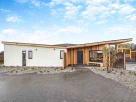 A modern house with a pathway and garden at Trelowen 2.0 Spa in Marhamchurch