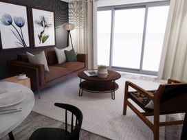 A living room with a sofa and coffee table at Arvor Duplex 2.0 in Marhamchurch