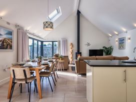 A dining room with a table and chairs at Nettlecoombe Spa Marhamchurch