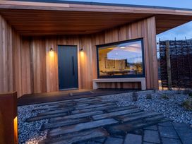 An entrance with a door and windows at Trelowen 4.0 Spa in Marhamchurch