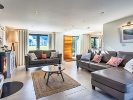 A living room with a sofa and coffee table at Arundell in Marhamchurch