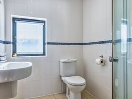 A bathroom with a sink and toilet at Arundell in Marhamchurch