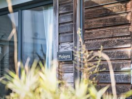 A sign on a wooden wall at Moleyns in Marhamchurch